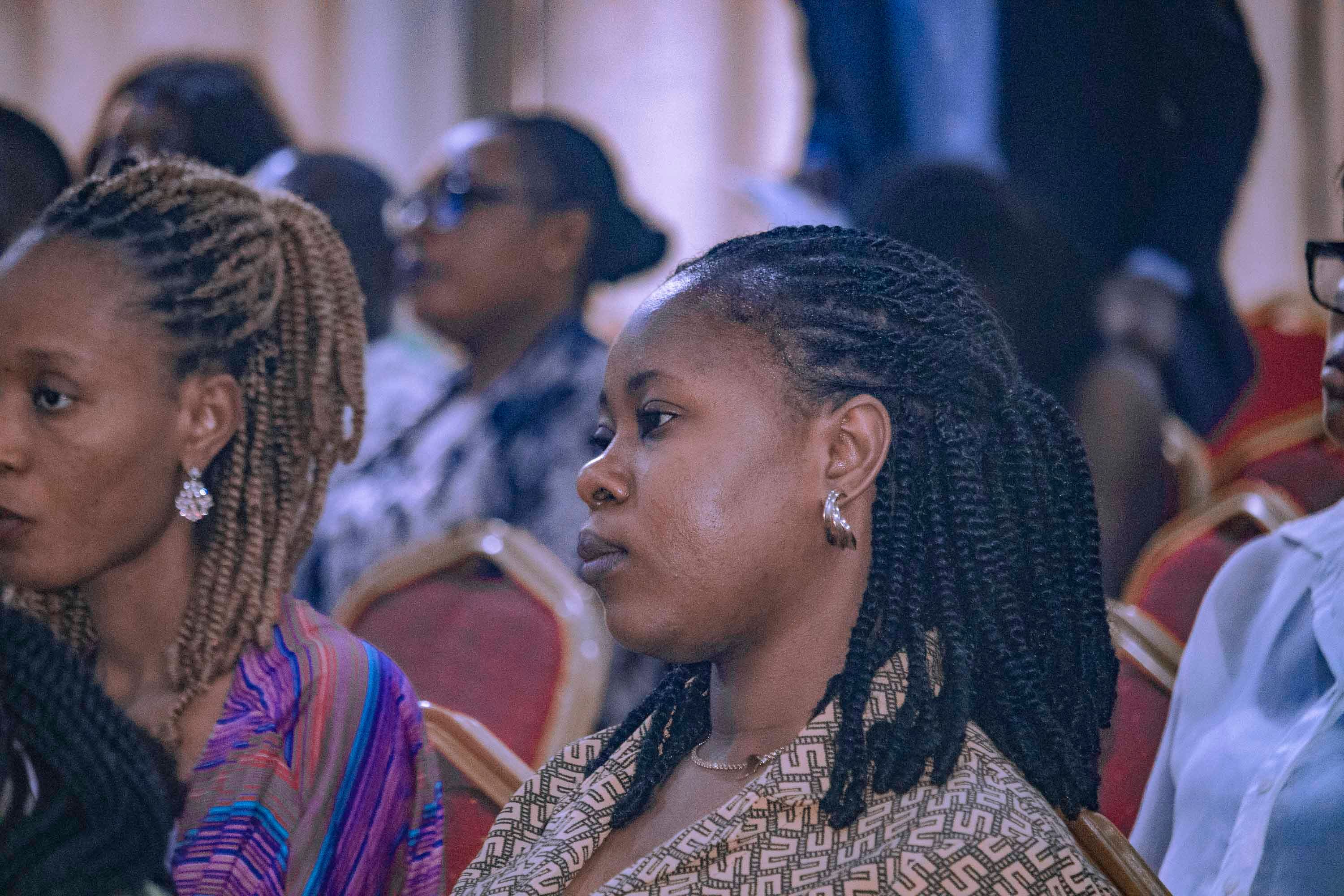 Young initiative participants listening during a development session